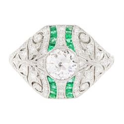 Platinum diamond and emerald ring, milgrain set with a transitional cut diamond of 0.57 ca...