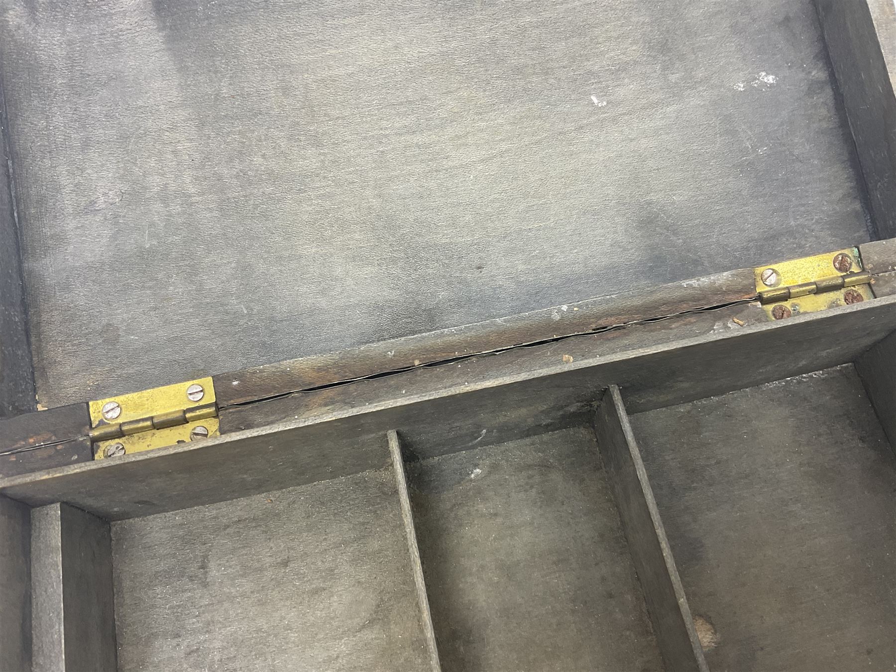 Liberty & Co Tudric pewter cigarette box, of plain rectangular form, with planished decoration to the slightly domed cover, opening to reveal a softwood interior, stamped Made in England 01234 Tudric Solkets beneath, together with another cigarette box, with applied pewter panels repousse decorated throughout with flower heads and leaves, with compartmentalised softwood interior, largest H5.5cm, W23cm