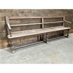 Victorian pitch pine bench pew, turned arms and legs, rail back with plank seat, 249cm