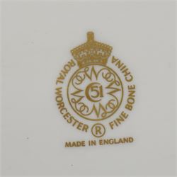 Pair of Royal Worcester cabinet plates painted with central panel of fruit by Peter Platt signed 'P Platt' within a green and gilt surround D27cm