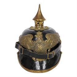 WWI Prussian guard regiment Pickelhaube, the black leather skull with brass ball finial, b...
