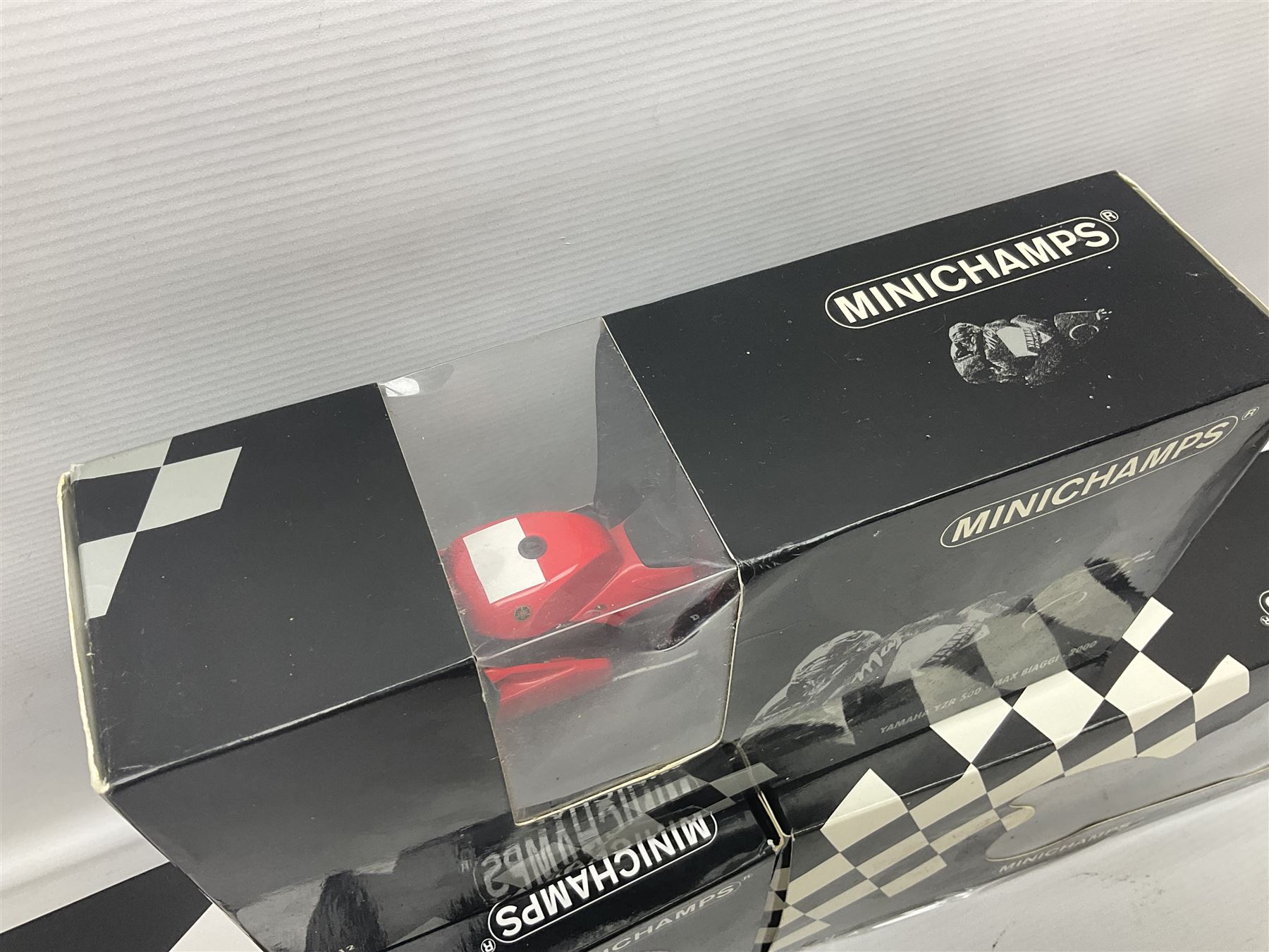 Three Minichamps 1:12 scale die-cast motorcycles - Yamaha YZR 500 Max Biaggi 2000; Yamaha YZR-M1 Colin Edwards Fiat Yamaha Team MotoGP 2007 GP Australia; and Yamaha YZR 500Team Yamaha Max Biaggi 500ccGP 2001; all boxed (3)