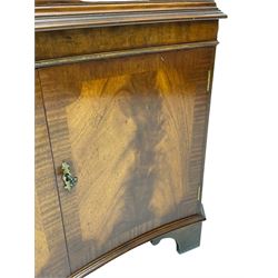 Georgian design mahogany concaved corner cabinet, projecting dentil cornice over two astragal glazed doors, double cupboard below, on bracket feet