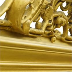 19th century Rococo Revival large gilt framed mirror, with bevelled rounded rectangular plate enclosed by a carved giltwood frame, surmounted by pierced scroll and foliate cresting, floral and scroll details to sides and corners