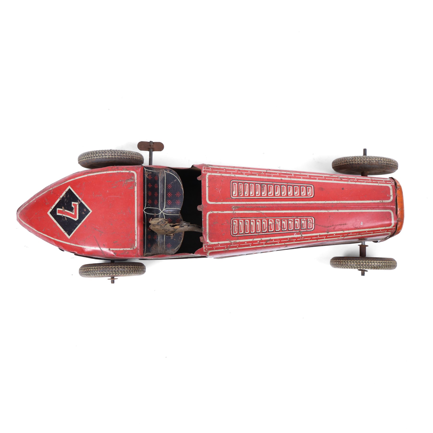 Mettoy tinplate clockwork racing car, the boat tailed red body with lithographed details, racing no. 7, with Dunlop Fort tyres, driver and key, H8cm, L32cm