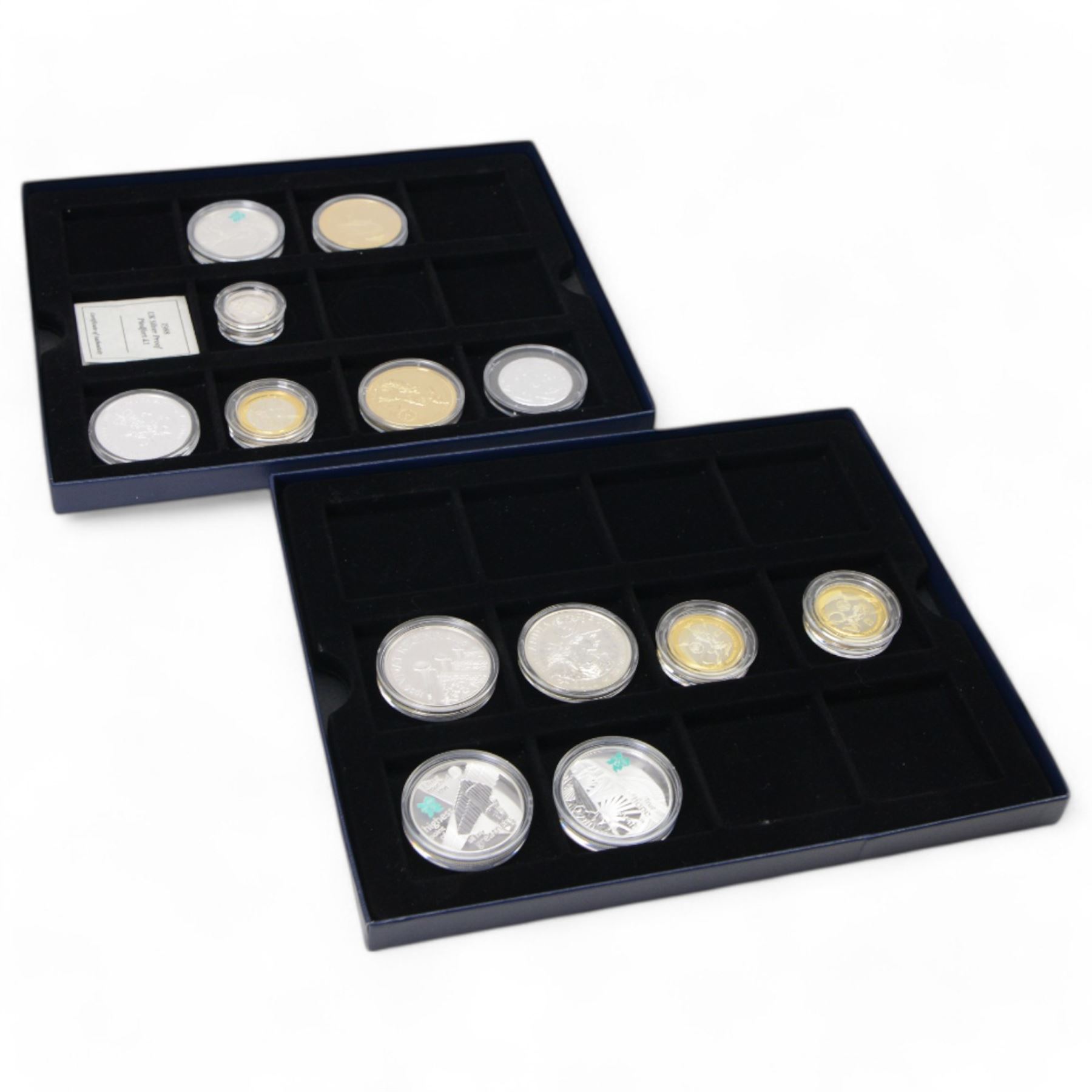 Commemorative coinage with silver proof examples, including 1998 silver proof piedfort one pound, 2006 '80th Birthday of Queen Elizabeth II' silver five pounds, 2010 'Britannia' one ounce fine silver coin, 2002 'Scottish' 'Welsh' and 'English' silver proof two pound coins, 2009 'Angel of the North' and 'Flying Scotsman' silver proof five pound coins etc, housed in capsules in two card boxes 