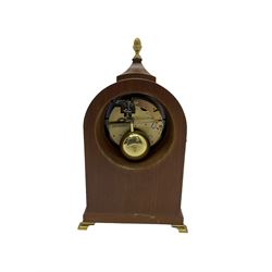 Comitti of London - 20th century 8-day mantle clock, in classic round topped mahogany case with inlaid stringing to the front and lion mask handles to the sides, raised on a narrow plinth with bracket feet, twin train going barrel movement with a floating balance escapement, striking the hours and half hours on a bell.    