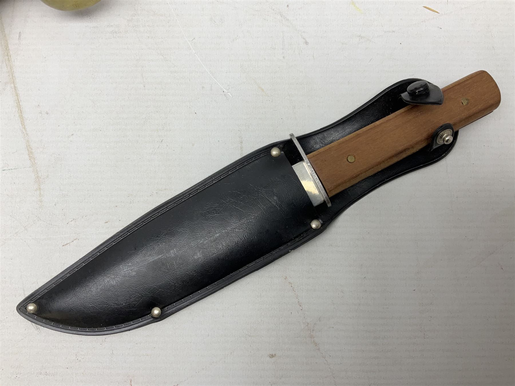 Reproduction non-firing flintlock pistol with brass skull crusher butt, the lock-plate inscribed 'Tower' and 'GR' L40cm; Sabre Japan Original Bowie Knife in sheath; and Indian embossed nickel two-piece walking cane (3)