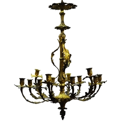  Late 19th century cast gilt metal and ormolu chandelier, the twelve acanthus scroll branches with urn shaped sconces and leaf drip pans, on shaped central support with foliate finial, H80cm, W62cm  