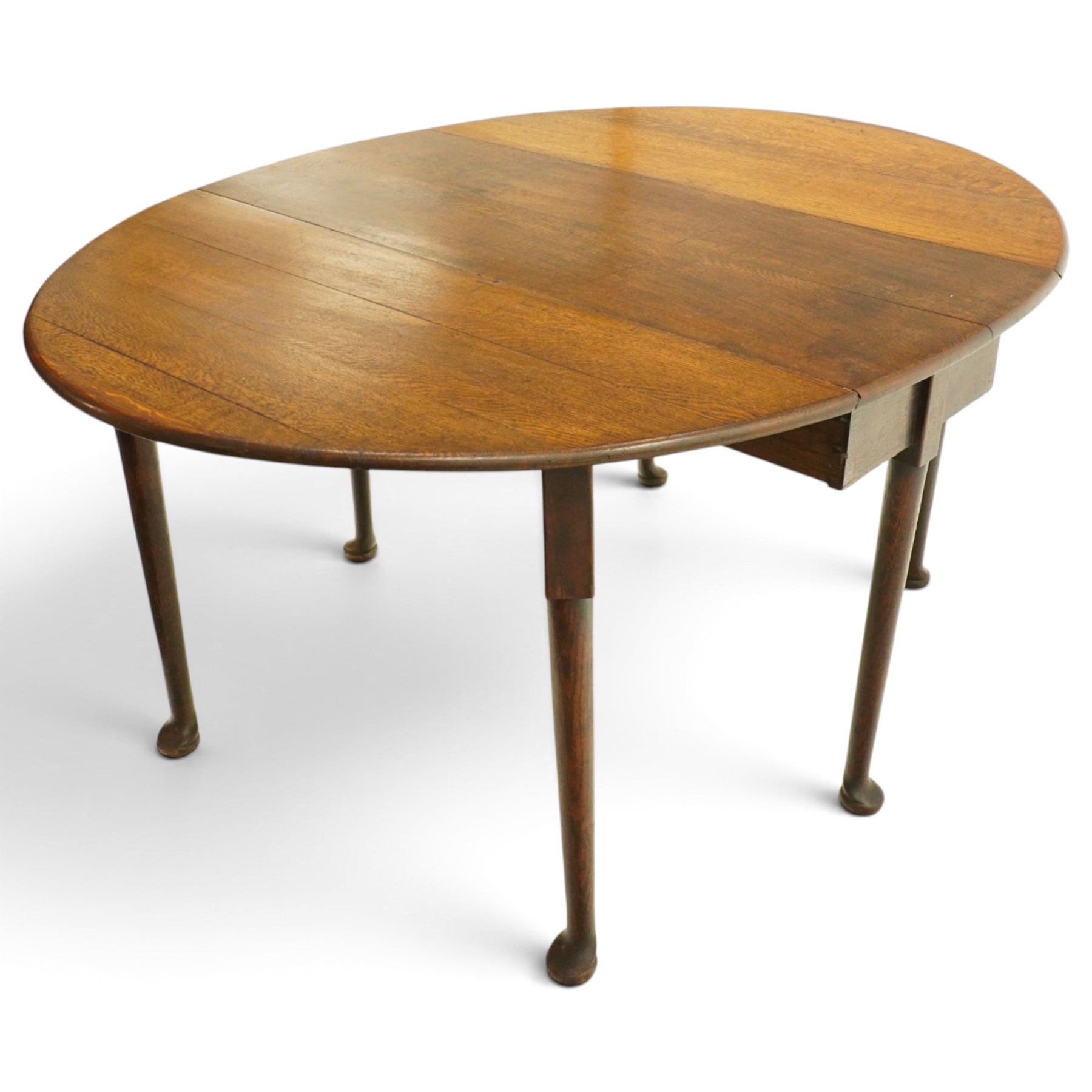 George III oak six-legged drop-leaf dining table, the oval drop-leaf top over six gate-leg supports with pad feet