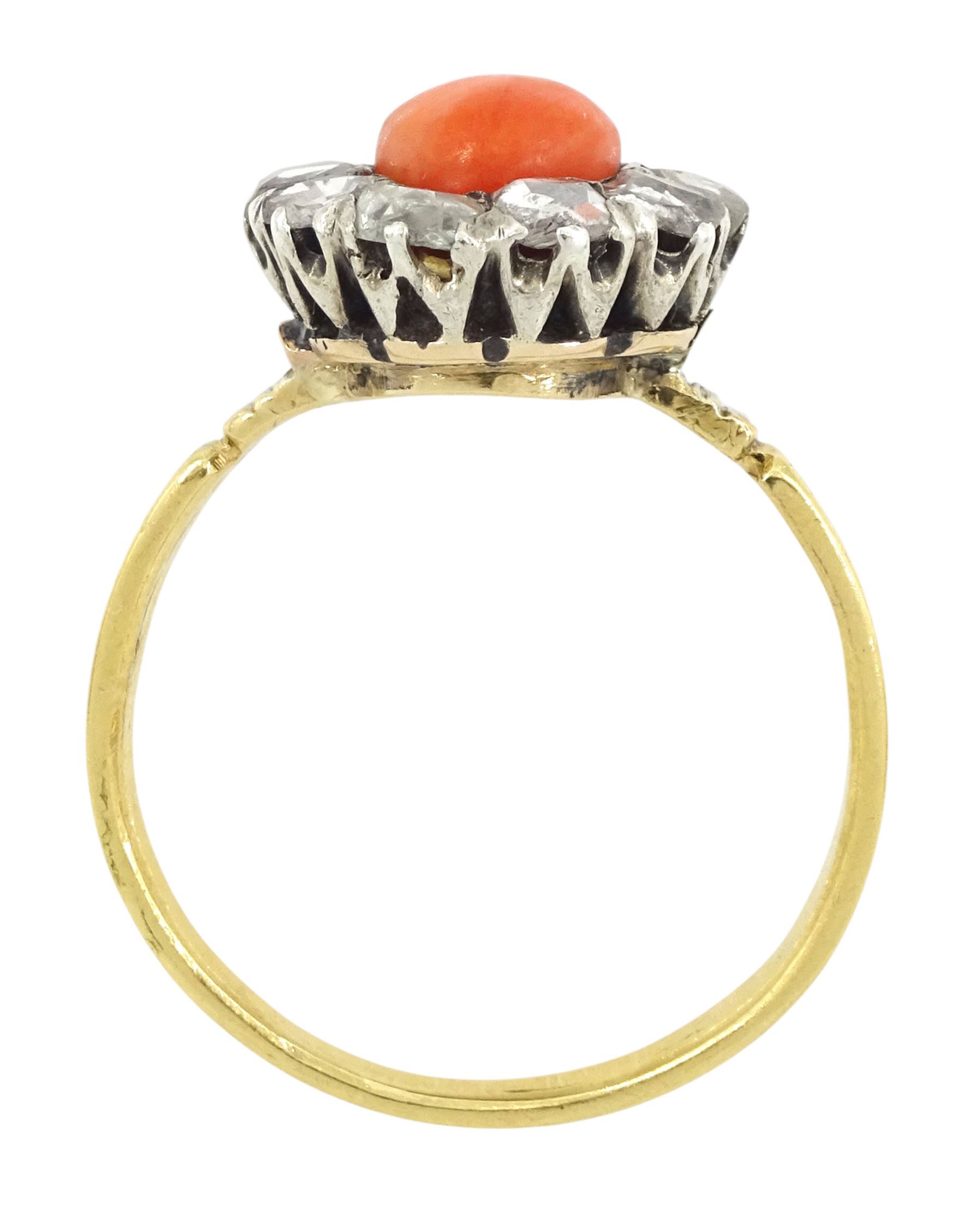 Early 20th century 18ct gold and silver coral and diamond cluster ring, single  cabochon cut coral, surrounded by ten rose cut diamond stones 