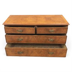 Traditional design walnut inlaid chest, with figured top with circular inlay and crossbanded top with moulded edge, figured drawers with cockbeaded edges and brass handles, raised on bracket feet