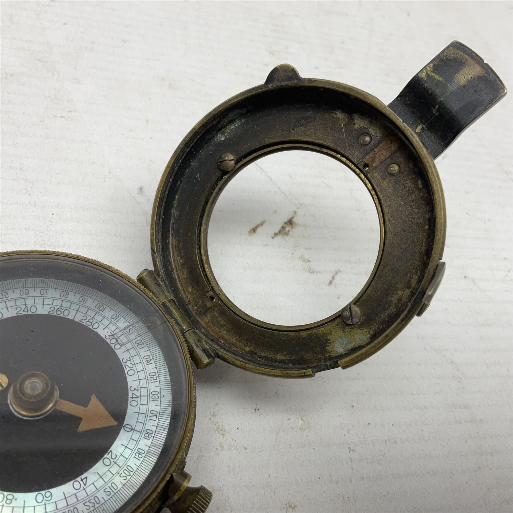 Broadhurst Clarkson brass and leather 4-draw telescope, the first draw with graduations, sliding lens shroud and leather covers for both ends on shoulder strap; marked 'Broadhurst Clarkson & Co. Ltd. 63 Farringdon Road London E.C.', L87cm fully extended; together with a WWI brass marching compass marked F-L No.123113 1918 (broad arrow); crudely etched L.H. McD. Latham; in associated Brooks & Co. leather case dated 1913 stamped W.B. Constable (2)