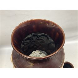 Pair of Bay West German vases, with bold moulded flower and foliage decoration in green, orange and ochre on brown ground, largest H40cm