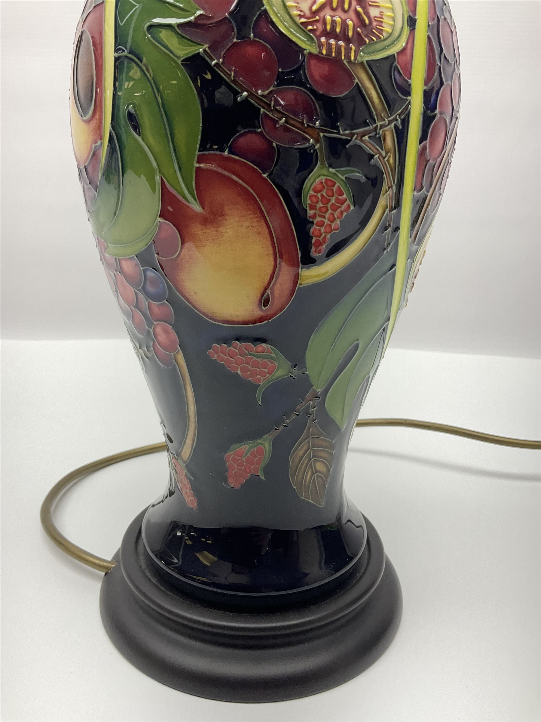 Moorcroft table lamp of baluster form, decorated in the Queens Choice pattern by Emma Bossons, H49cm