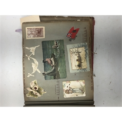 Victorian scrap book containing various cuttings and small greetings cards, all glued down, together with approximately sixty five mostly Edwardian topographical postcards, all used with some postmark interest. 