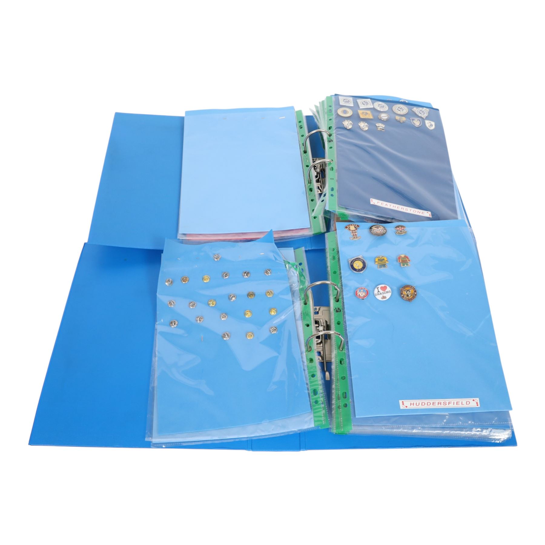 Rugby League club enamel badge collection, from teams including Bradford, Castleford, Huddersfield, Hull FC, Leeds, Leigh, St Helens, Salford, Wakefield, Wigan, York, Batley, Barrow, Bramely, Dewsbury, Featherstone, Halifax, Hunslet, Keighley, Oldham, Rochdale, Sheffield, Widnes, Workington, etc, all circa 2021, housed in two folders, (approximately 250)