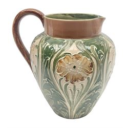 Moorcroft Macintyre Burslem jug, circa 1902, decorated with a motif of stylised flowers amongst scrolling foliage, in shades of brown and green on a peach ground, with printed mark beneath, H16cm