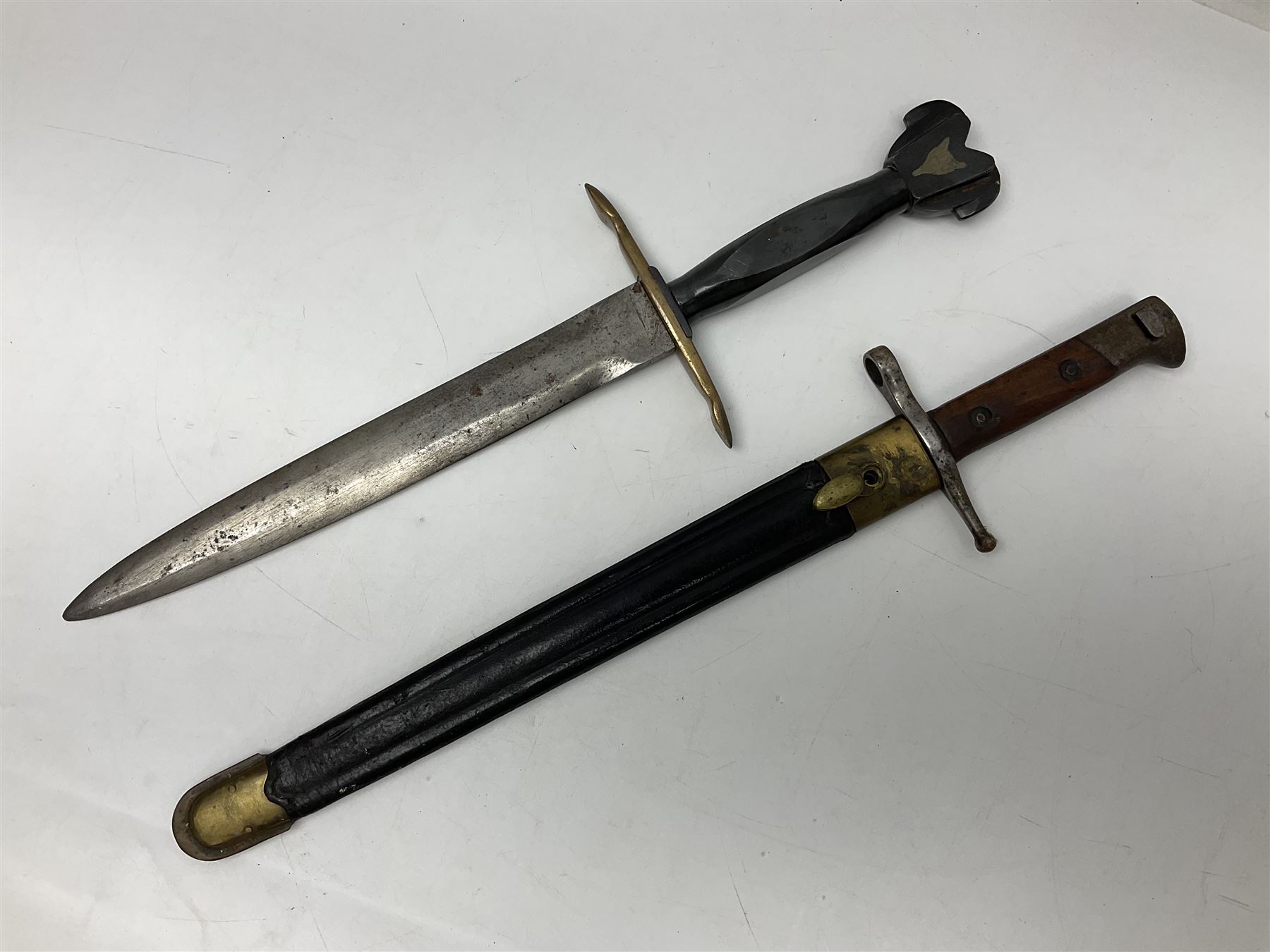 Italian Model 1891 bayonet with 30cm fullered blade; the crosspiece marked 'TERNI'; in associated brass and leather scabbard L43cm overall; and Knights Templar (?) short blade sword (no scabbard) (2)