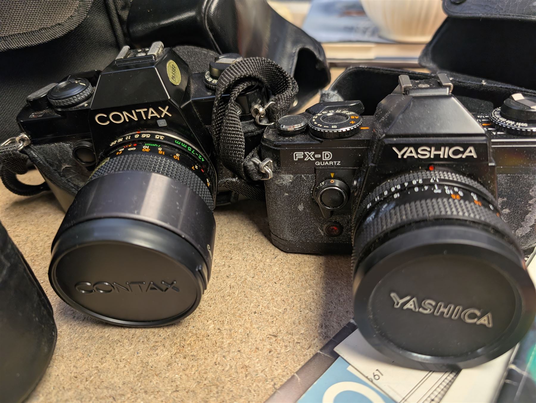 Contax SLR camera with a Yashica ML Zoom 42-75mm 1:3.5-4.5 lens, in case with accessories, together with a Yashica FX-D Quartz SLR camera with a Carl Zeiss Planar 1.7/50 lens, with filters, instruction booklets and other accessories