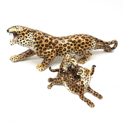  Large Italian pottery figure of a Leopard by Febland and another matching group of two Leopards playing, L57cm max (2)  