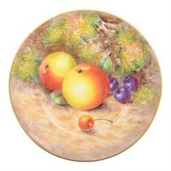 20th century Royal Worcester footed bowl, hand painted with gilt interior, the exterior a still life of fruit upon a mossy ground, signed Freeman, with black printed mark beneath, together with plate side plate and cabinet plate, bowl, H8cm, D13cm
