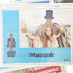  Collection of seventeen James Bond lobby cards starring Sean Connery and Roger Moore including Thunderball, You only Live Twice, Live and Let Die, From Russia with Love etc each 21cm x 27.5cm 
