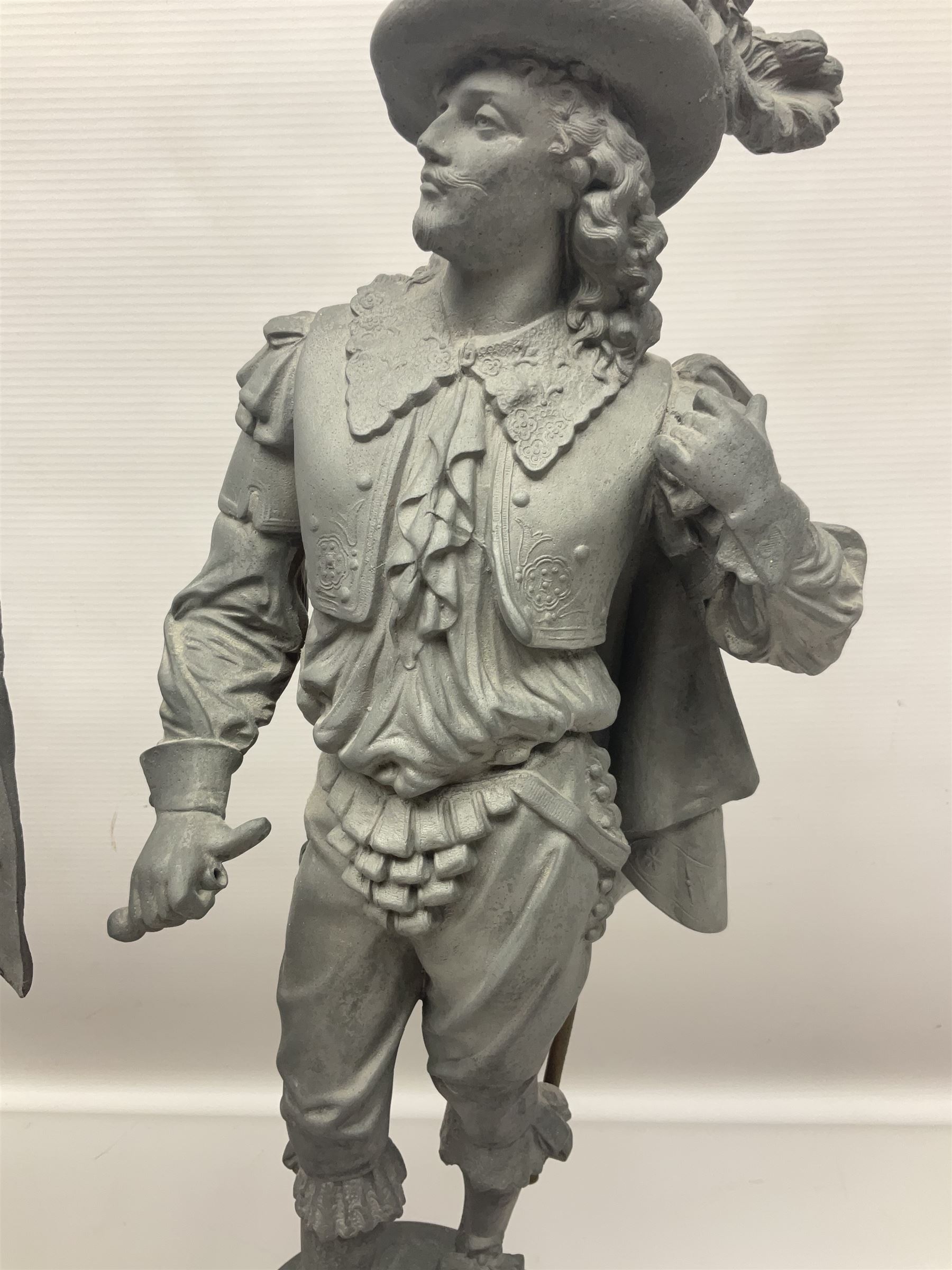 Pair of spelter figures modeled as Cavaliers, together with a spelter figure of Joan of Arc, largest H52cm