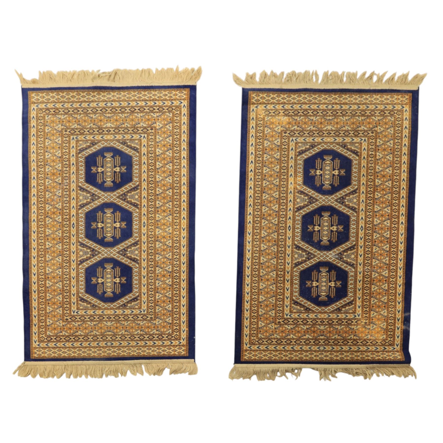 Caucasian two small rugs and one wall hanging rug, rugs (W 69cm L 148cm) wall hanger (W 124cm, L 107cm)