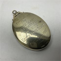 Silver and enamel oval locket pendant, inscribed Pudsey Philatelic Society President, and decorated in enamel with a Penny Black stamp, opening to reveal a gilt interior, with presentation engraving verso, hallmarked Haseler & Restall, Birmingham 1981, contained within fitted case, H6.5cm