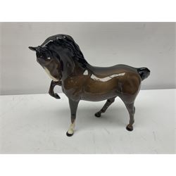 Four Beswick horses, including Exmoor no 1645, Black Beauty foal and two others 