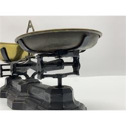 Black painted and brass kitchen balance scales with graduated set of brass weights
