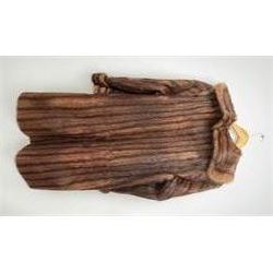 A lined Musquash fur coat. 