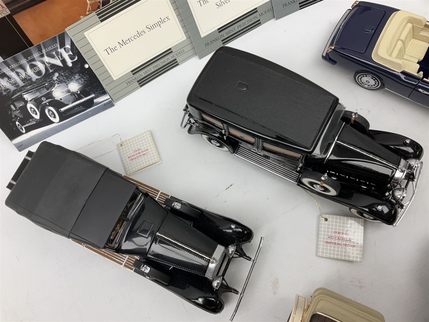 Eight Franklin Mint diecast models of cars, 1911 Rolls-Royce Tourer, The Rolls-Royce Corniche IV, The Mercedes Simplex, 1955 Rolls-Royce Silver Cloud, 1921 Rolls-Royce Silver Ghost, 1907 Rolls-Royce Silver ghost,1929 Rolls-Royce Phantom I,  and 1930 V-16 452 Cadillac Imperial Sedan, all with original tags attached
