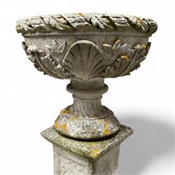 Pair of cast stone ornate garden urns, on plinth bases