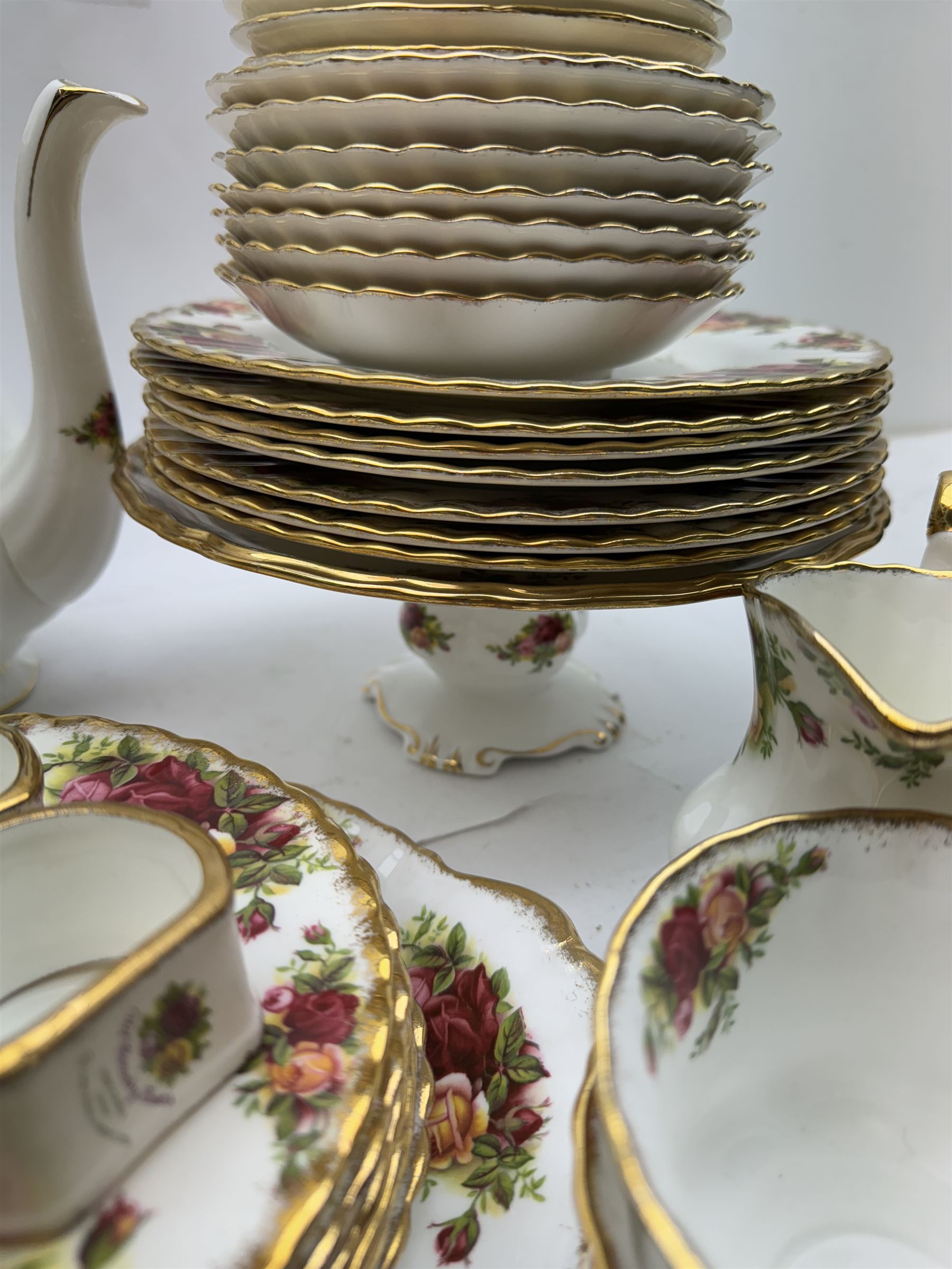 Royal Albert Old Country Roses pattern tea wares, comprising coffee pot, jug and sugar bowl, cake stands, napkin rings, teacups and saucers, side plates, dessert plates, small plates, all with printed marks beneath