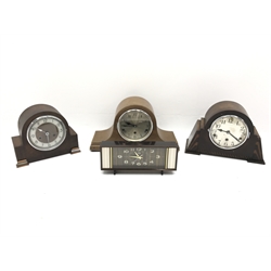  Two 20th century oak cased mantel clocks with three train movements chiming on rods, a similar twin train half hour strike mantel clock and 1960's alarm clock (4)  