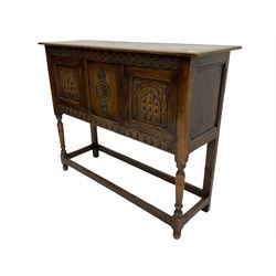 17th century style caved oak side cabinet, fitted with two cupboards, stretcher base