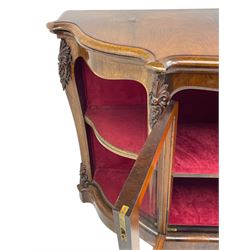 19th century rosewood buffet credenza, bombe form with shaped and moulded top, two central glazed doors with foliate moulded gilt slips, the red fabric-lined interior fitted with a single shelf, flanked by open shelves with raised gilt metal lips, the uprights decorated with shell and flower head carved cartouche mounts, acanthus leaf scroll carved lower mounts, on shaped and moulded plinth base 