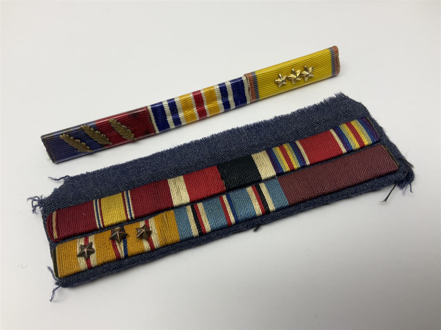 Collection of approximately sixty worldwide medals, metal badges, belt buckles, cloth badges, trench art, brass button stick etc