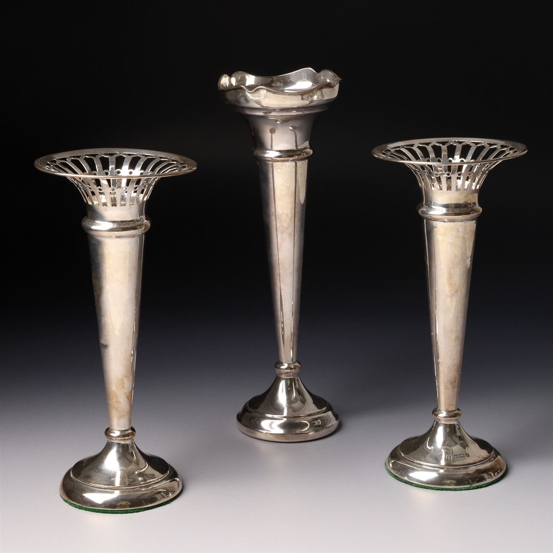 Pair of silver trumpet shape vases with pierced rims H18cm Sheffield 1910 Maker James Deakin & Sons and one other vase H21cm Birmingham 1967