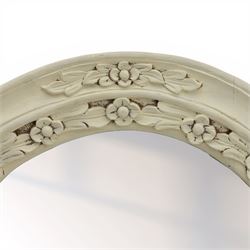 Oval painted pine wall mirror, with carved stepped edge, with mounts for hanging