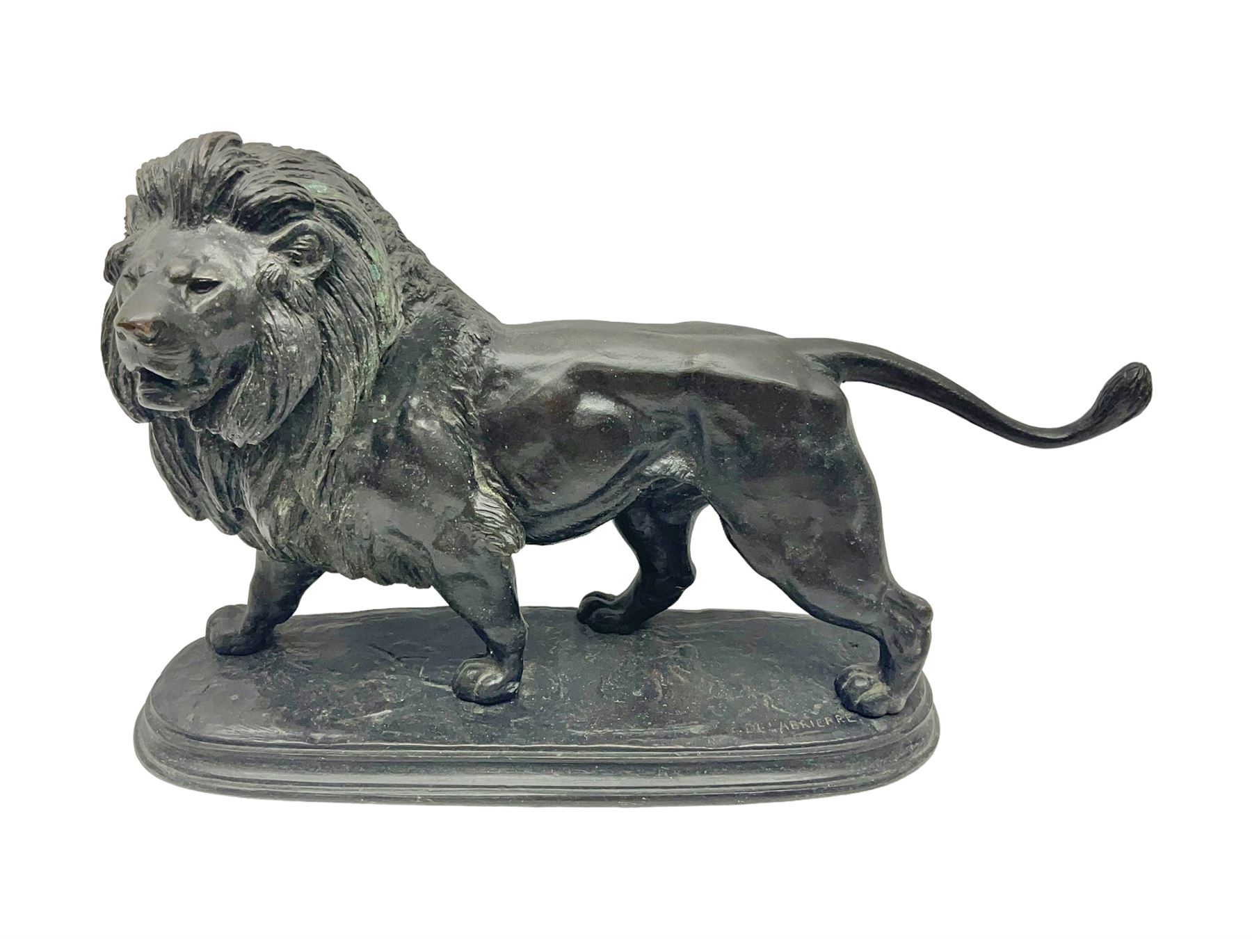 After Paul Edouard Delabrierre (French, 1829-1912), bronze, model of a lion, upon an oval base, signed E Delabrierre, overall H29.5cm, L46cm