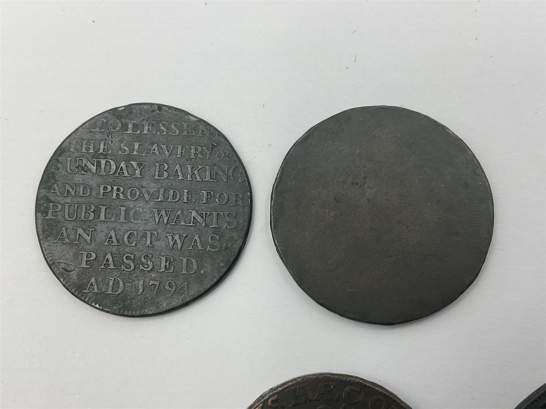 Four Georgian tokens comprising 1791 Liverpool Thomas Clarke Halfpenny, two 1795 Bakers Halfpennies and 1797 Stafford Halfpenny 
