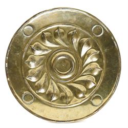Central section of a 17th century Nuremberg brass alms dish, central rosette surrounded by Gothic inscription, intersected by roundels with engraved heads, D23cm 