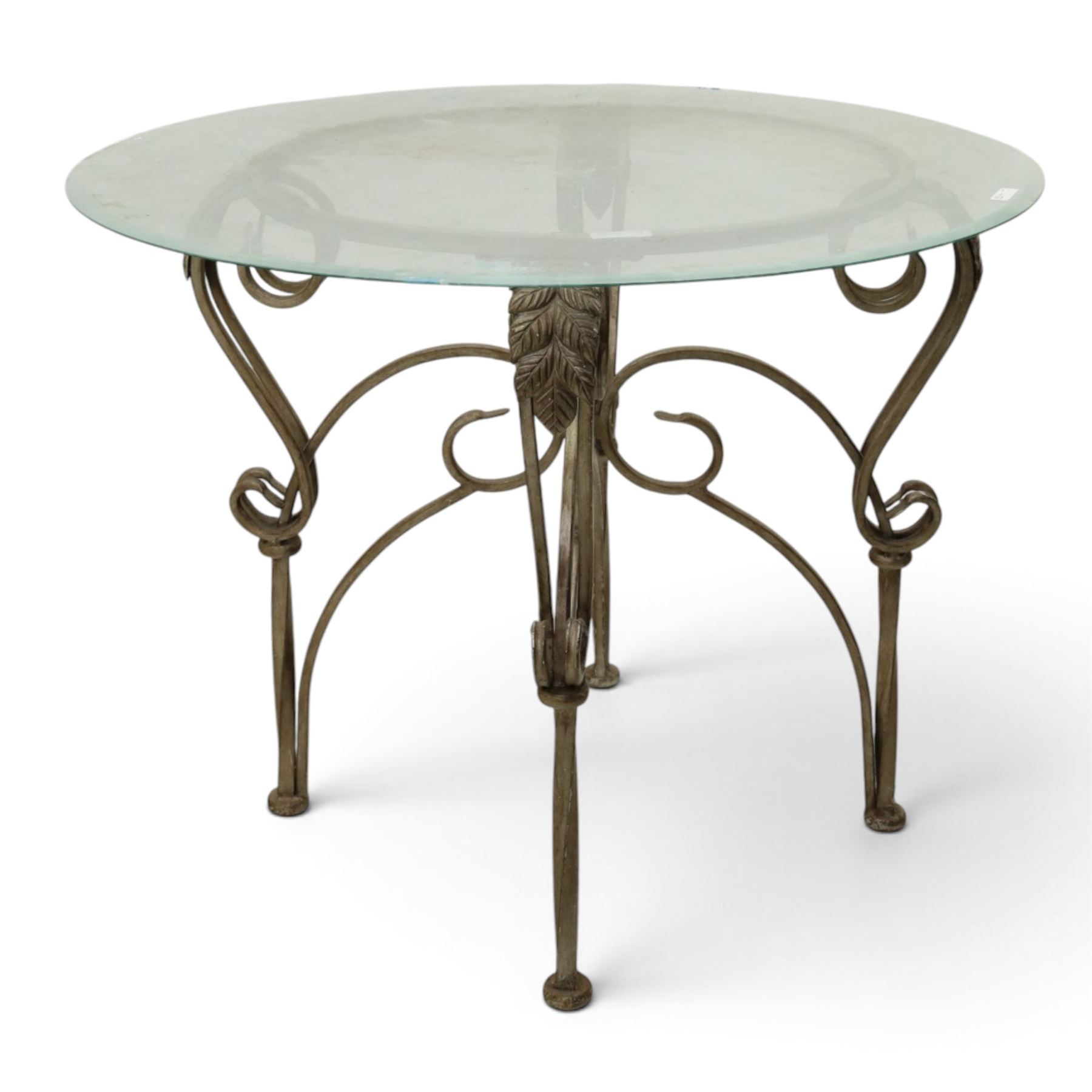Wrought metal and glass table, with silvered foliate and scrolled design
