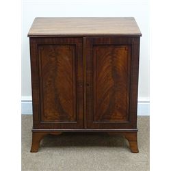 Regency ebony strung mahogany medal or coin collectors cabinet, with reeded top, two panel doors enclosing eleven drawers, shaped out splayed bracket feet