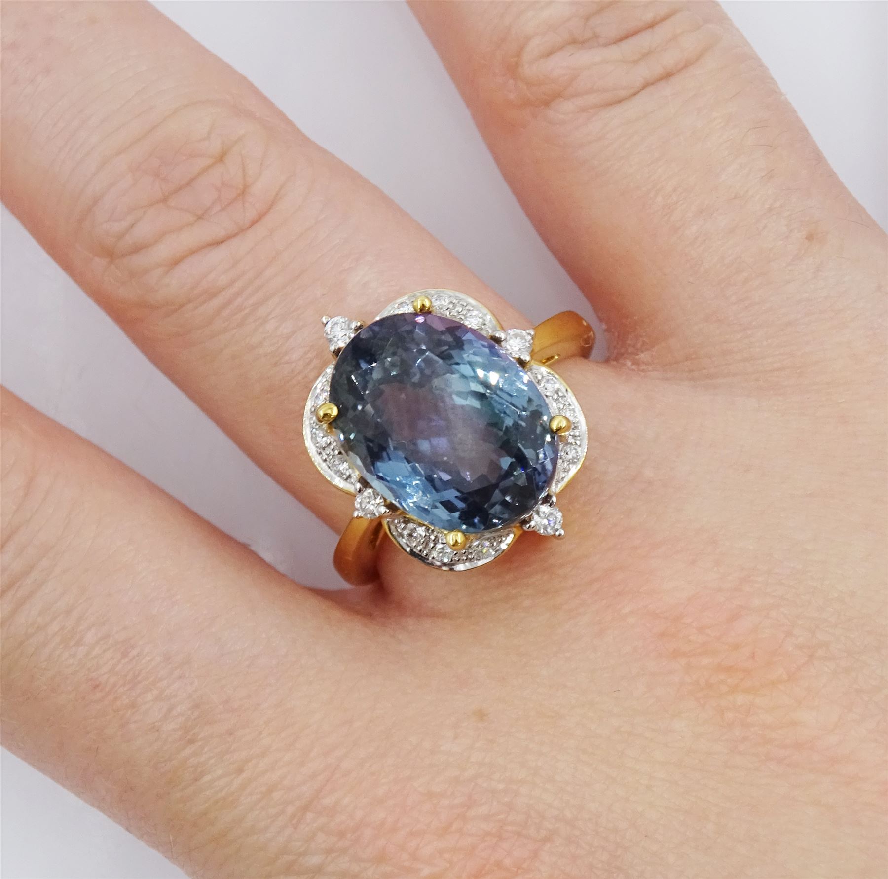 18ct gold oval cut fancy colour tanzanite and round brilliant cut diamond cluster ring, hallmarked, tanzanite approx 9.00 carat