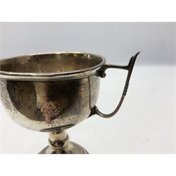 1930's silver twin handled trophy cup, upon black circular plinth, hallmarked Birmingham 1936, approximate silver weight 47 grams