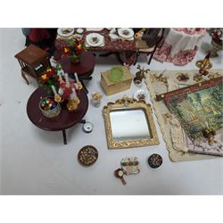 Dolls house living room and dining room furniture, including arm chairs, desk, fireplaces, dressers, tables, eight figures and a large collection of predominantly Christmas themed food, accessories and decorations